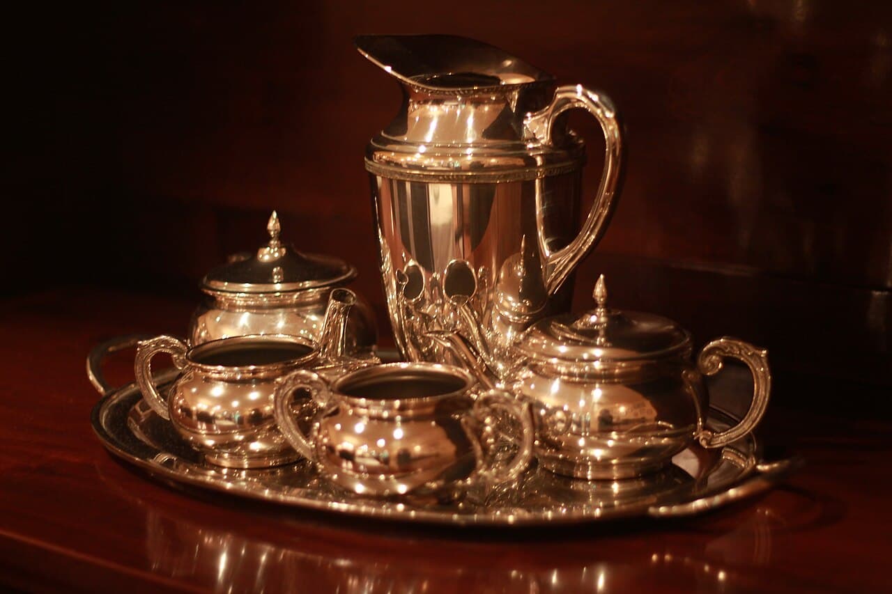 Antique silver coffee service on a silver tray at Café Girondino in São Paulo's historic center