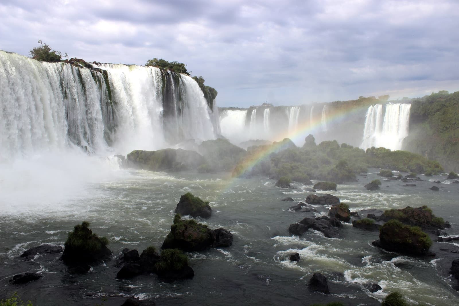 A rainbow arcing across the falls seen from the Mirante da Garganta do Diabo in Parque Nacional do Iguaçu on the Brazilian side