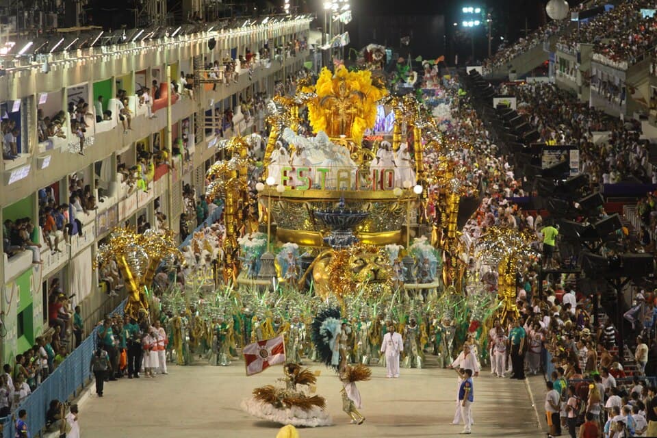 Grand samba parade at Rio’s Sambadrome with elaborate floats, dancers, and packed grandstands during Carnival.