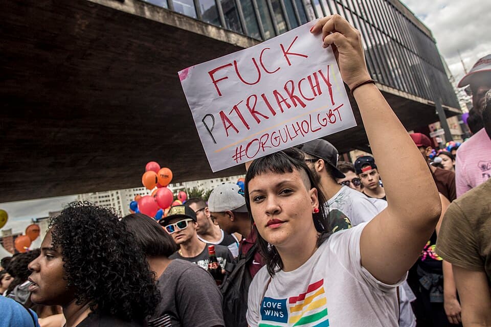 Marchers packing Avenida Paulista during the São Paulo LGBTQ+ Pride Parade with anti-patriarchy sign